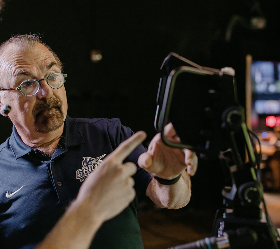 Film production student uses recording equipment.