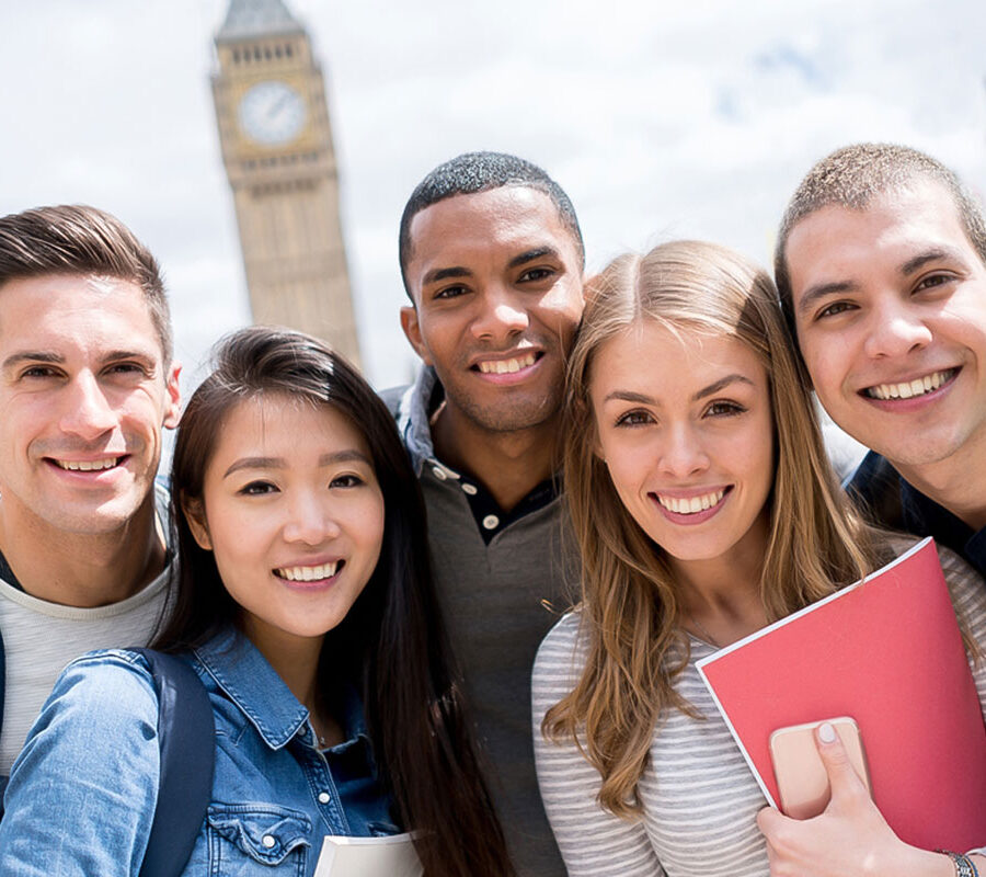 study abroad students standing in a group smiling
