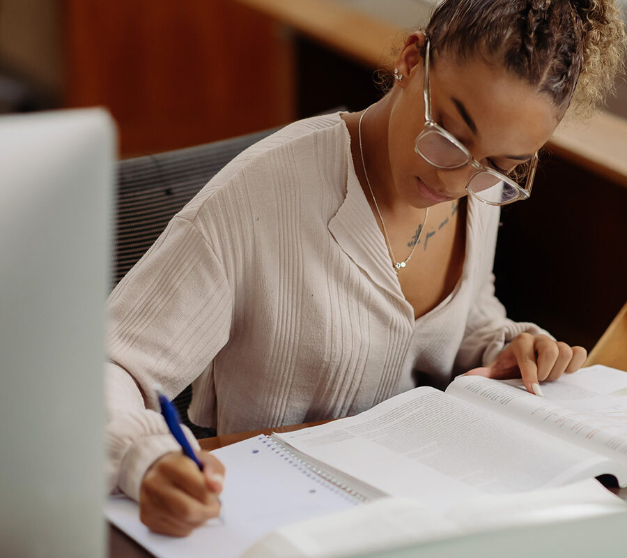 a journalism student studies for an exam