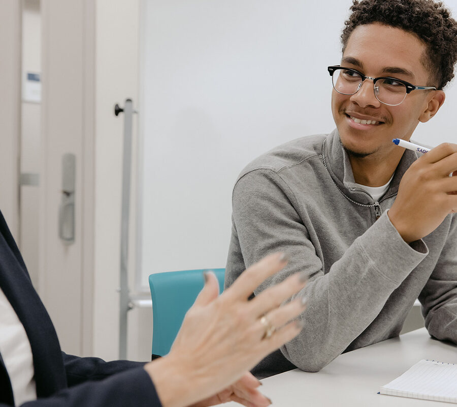 Mathematics student engages in classroom discussion.
