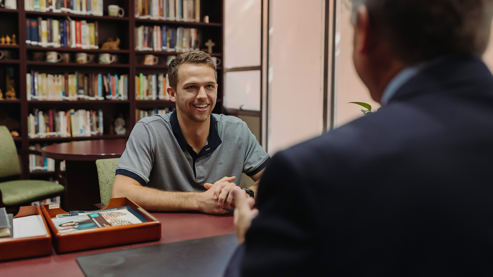PBA student engages in discussion with an instructor.