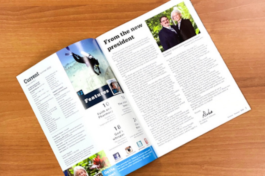 A copy of the Palm Beach Atlantic Alumni Magazine laying on a table