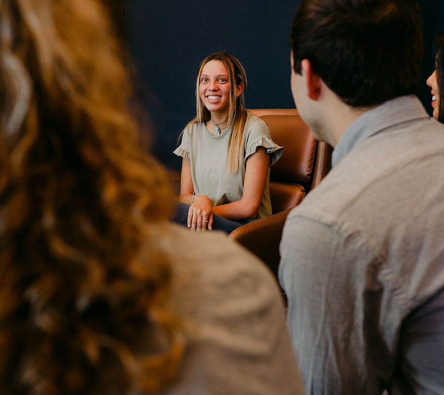 an intercultural studies major discusses with classmates