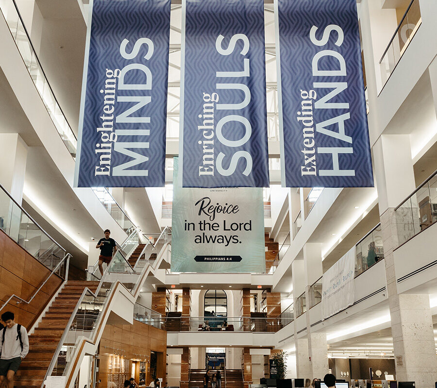 PBA banners inside the library that say enlightening minds, enriching souls, extending hands
