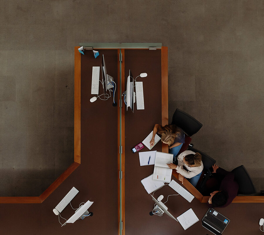 Bird's eye view of students studying in the library.