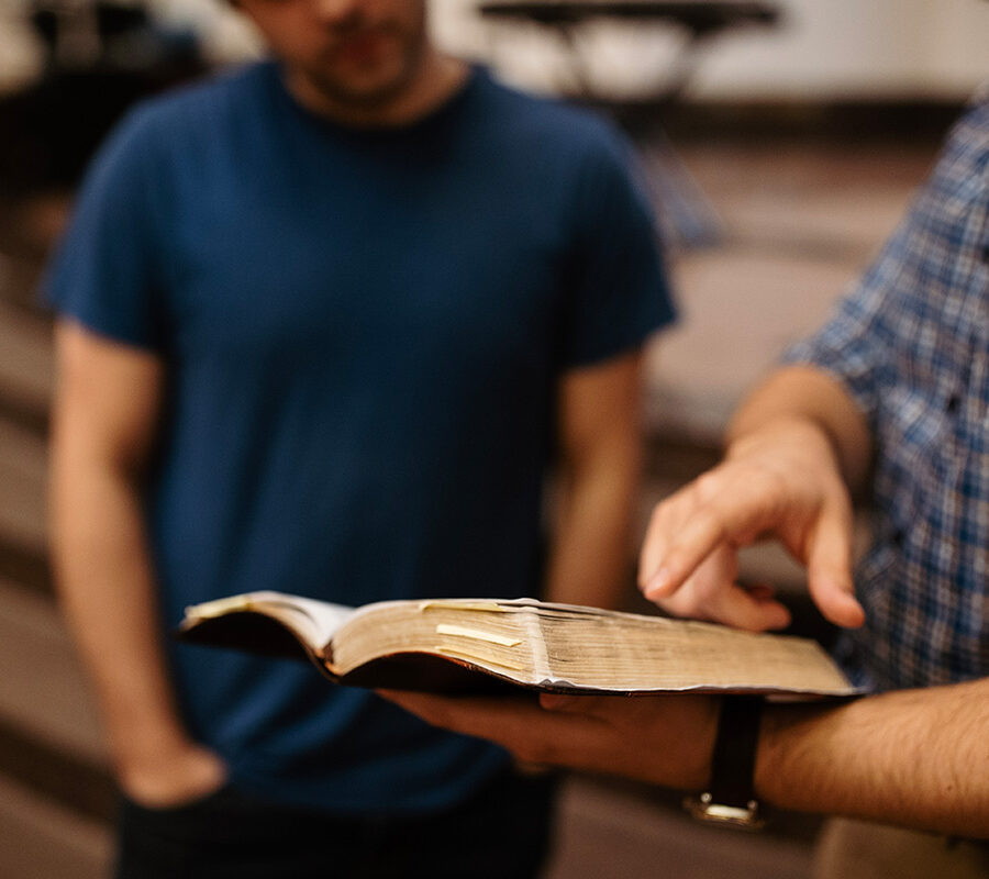 A biblical studies major reading from a Bible