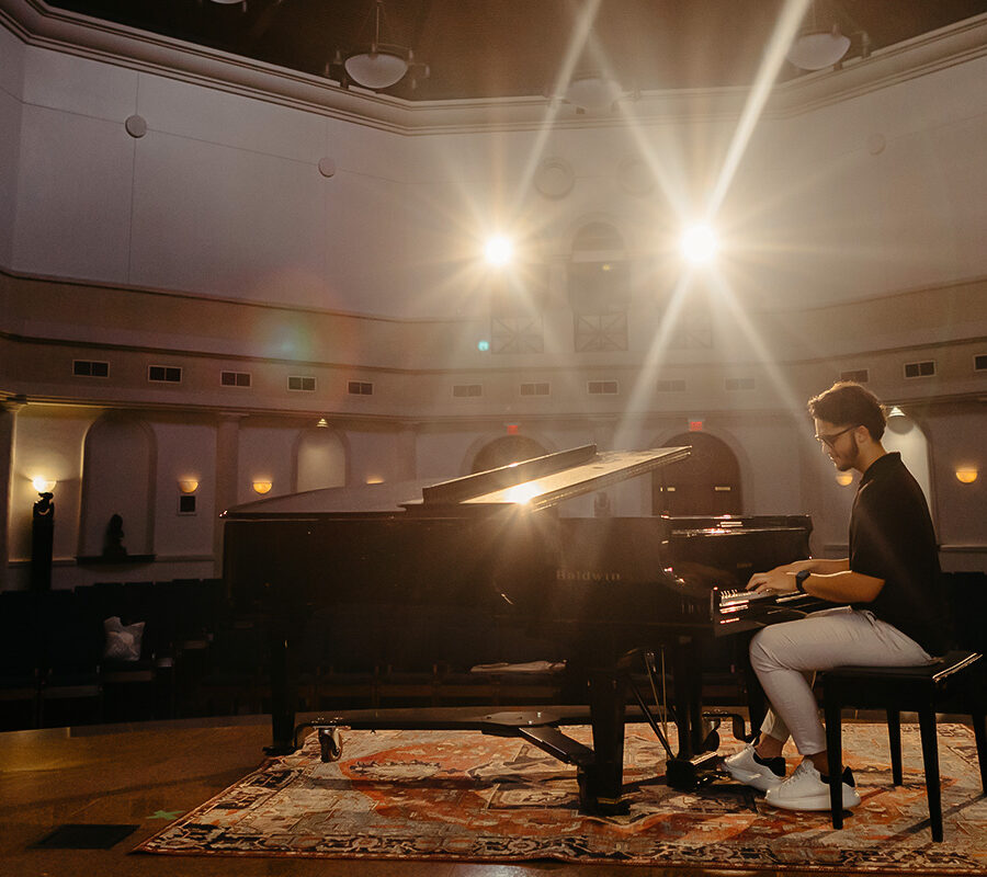 a student from the major in instrument performance playing the piano
