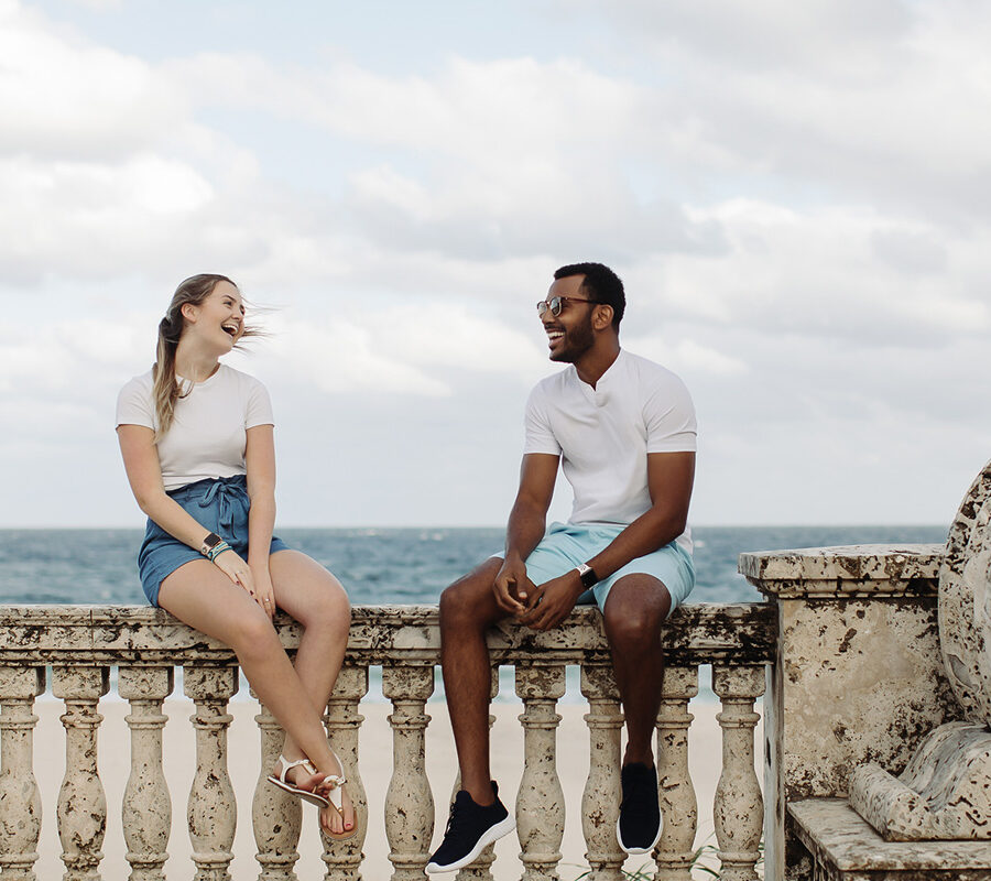 Two PBA students talk by the beach.